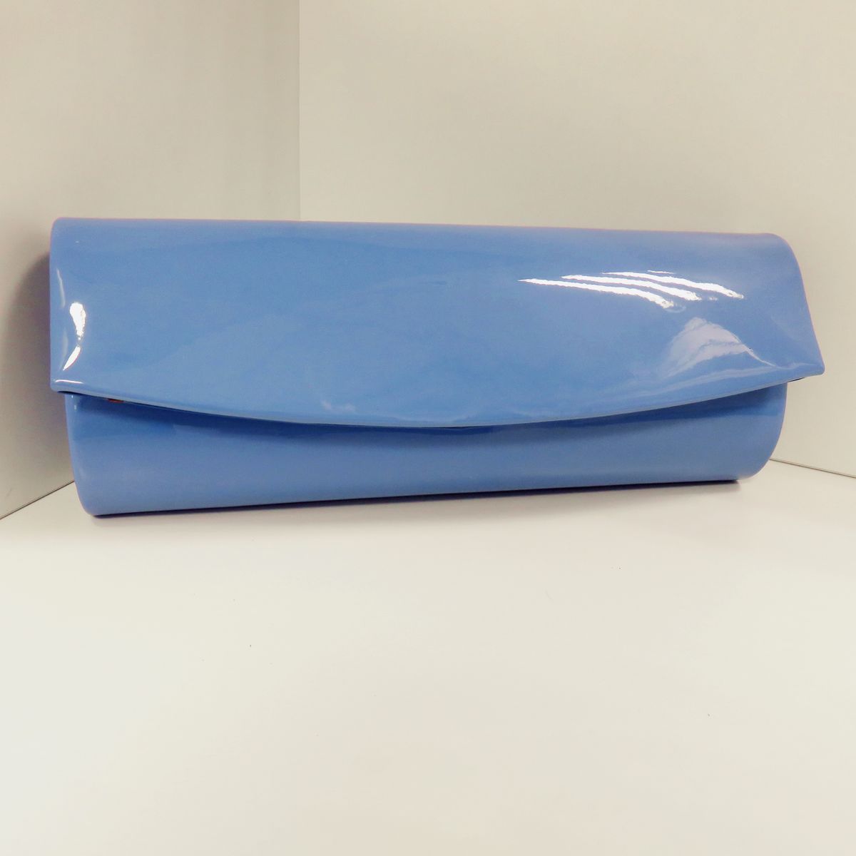 Modieuze clutch in lakleer