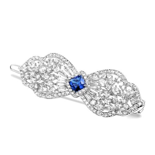 Extravagante haarclip in strikvorm met saffierblauw kristal